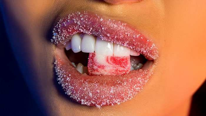 boca con dulce en dientes y labios significado problemas dentales biodescodificacion